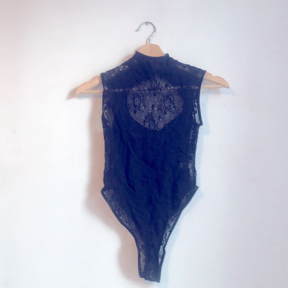 Black lace bodysuit. Size Small to Medium. Height neck. High cut thigh. EUC